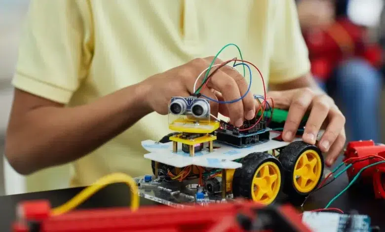 Boy Playing with an Electronic Toy Car
