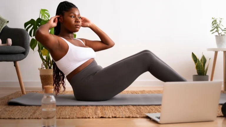 Full shot woman training with laptop